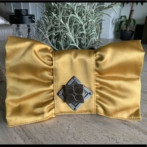 BCBG satin clutch mustard